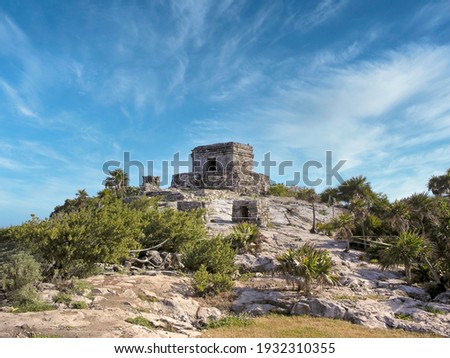 Mayan ruins in Tulum Yucatan peninsula against blue sky Royalty-Free Stock Photo #1932310355