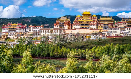 Songzanlin monastery scenic view surrounded by green nature in Shangri-La Yunnan China Royalty-Free Stock Photo #1932311117