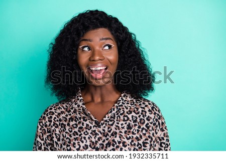 Photo of excited funny lady open mouth look up empty space wear leopard print shirt isolated teal color background
