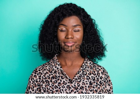Photo of inspired brunette lady closed eyes wear leopard print shirt isolated turquoise color background