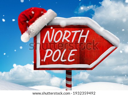 North pole text on red board sign with santa hat and winter landscape in background. christmas greetings, celebration and festivity concept digitally generated image.