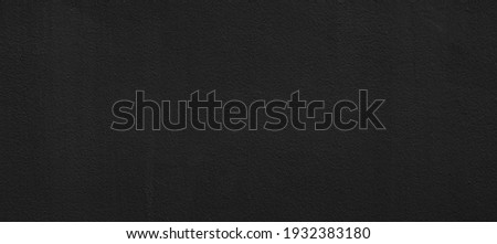 Panorama of Vintage black painted concrete wall texture and background seamless Royalty-Free Stock Photo #1932383180