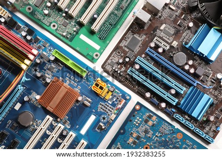 Computer motherboards on white table, flat lay. Electronic device