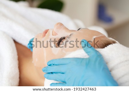 Young beautiful woman in a face mask, skin care