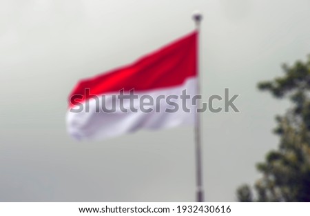 Defocused abstract background of Indonesia and Monaco national flag, The Red and white Flag, national symbol of Republic of Indonesia and The Principality of Monaco