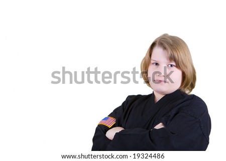 A teen in a black karate uniform on a white background.