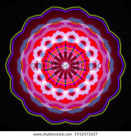 Ornament on a black background. Technically modified, abstract pattern.Fantasy color pattern in combination of red and white with a flower shape in the center.