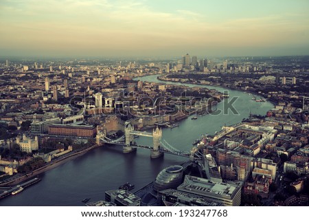 London rooftop view panorama at sunset with urban architectures and Thames River.