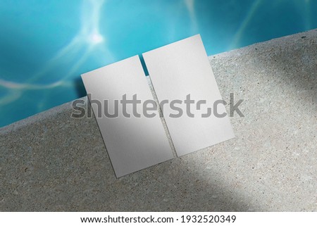 Clean minimal business card mockup on water side background. 
