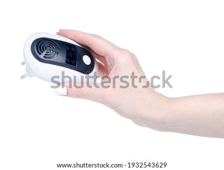 Electronic sonic insect repeller in hand on white background iso