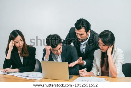 Group of business people is upset and getting stress about their unsuccessful project while their boss complaining. Working and Failure Concept. Royalty-Free Stock Photo #1932551552