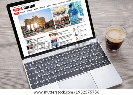 Sample news website opened on laptop's screen. All contents on website are completely made up. Royalty-Free Stock Photo #1932575756
