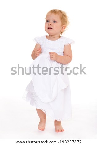 Very beautiful little girl in white dress