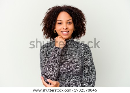 Young african american mixed race woman isolated smiling happy and confident, touching chin with hand. Royalty-Free Stock Photo #1932578846
