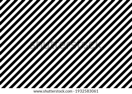 Black and white diagonal stripes pattern background Royalty-Free Stock Photo #1932583061
