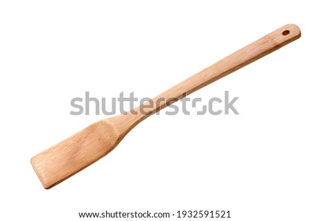 Wooden cooking flat spatula isolated over white Royalty-Free Stock Photo #1932591521