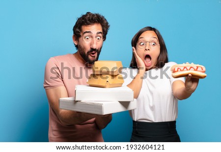 young couple having take away fast food to home.