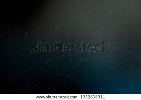 dust and scratches on a dark background. Items to overlay in the screen in photoshop. Lighting in the top