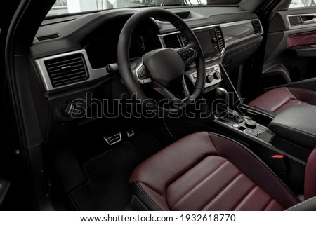 Luxury car Interior - steering wheel, shift lever, dashboard and touch screen Royalty-Free Stock Photo #1932618770