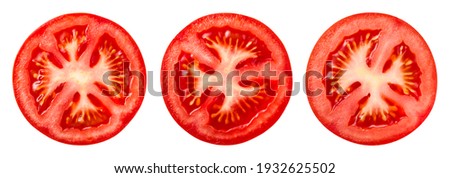 Tomato slice top view isolate. Tomato on white background. Set of round tomato slices. With clipping path. Royalty-Free Stock Photo #1932625502