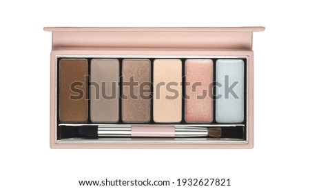 Open cosmetic set with eye shadows and makeup brush in pink leather case isolated on white background. Top view Royalty-Free Stock Photo #1932627821