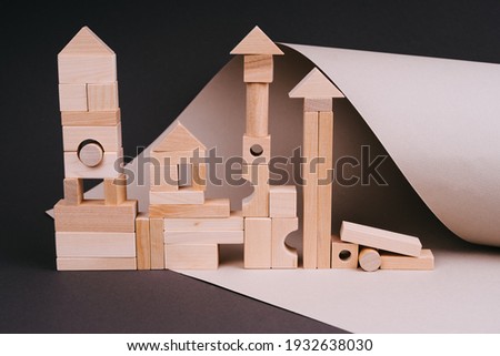 A wooden construction for children. Toys made of natural material. Eco-toys. Wooden toys on gray background. Color 2021.