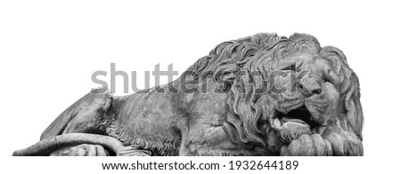 Ancient stone statue of lion isolated on white background. Selective focus on eyes of lion.