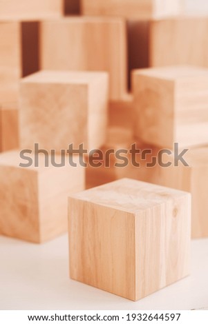 Stack wooden blocks from natural wood on a white background. Copy, empty space for text.
