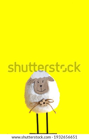 Easter sheep on a yellow background. Easter greeting Card