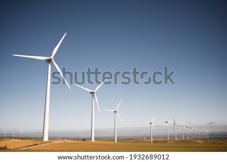 Wind turbines for electric power production, Zaragoza Province, Aragon in Spain. Royalty-Free Stock Photo #1932689012