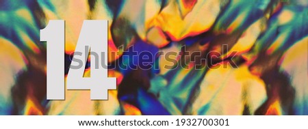 Wide banner. Number 14 fourteen on the blurry iridescent holographic foil background. Colorful reflective folia. Greeting card. Copy space. Flat lay. 