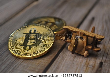 Macro view of gold and silver color shiny coins with Bitcoin symbol