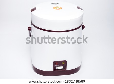 A picture of portable rice cooker on isolated white background.