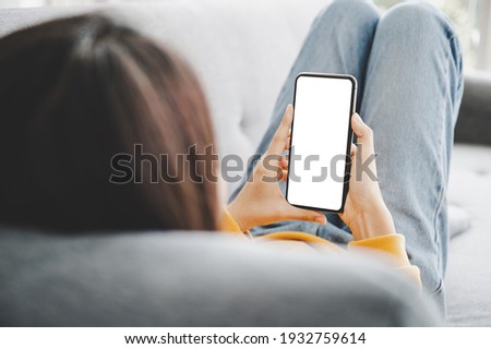 Woman using mobile smartphone and device white screen empty space smart phone, clipping path included