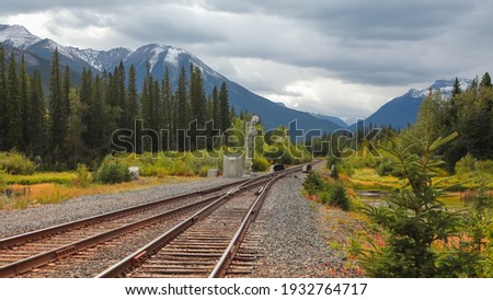 Train tracks through Banff national park Royalty-Free Stock Photo #1932764717
