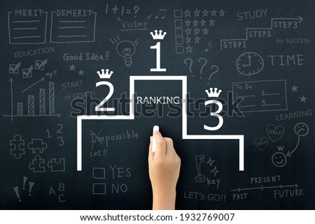 Ranking images, child's hand drawing podium on black board Royalty-Free Stock Photo #1932769007