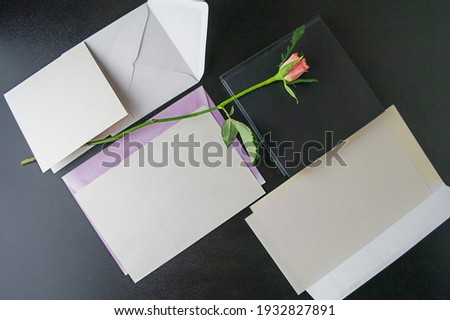 Cards and envelopes and rose for mockup, top view, flatley. High quality photo