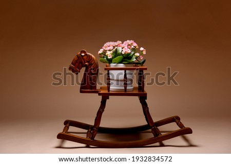 Wooden rocking horse with flowers