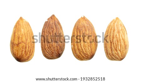 Close up of almond nuts isolated on white background.