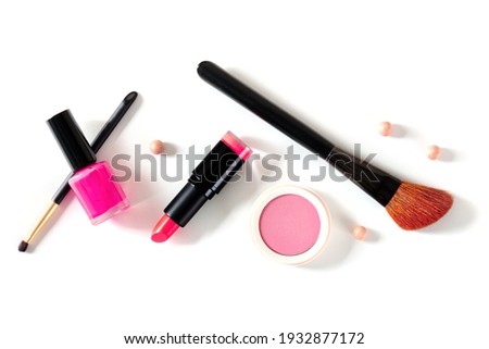 Make-up tools on a white background, shot from the top. Brushes, lipstick and other accessories