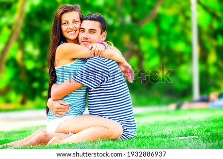 Young teen couple kissing at outdoor
