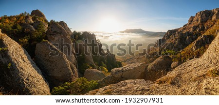 Beautiful autumn foggy landscape in the mountains, panoramic view. Crimea, Ghost valley, Mount Demerdzhi.