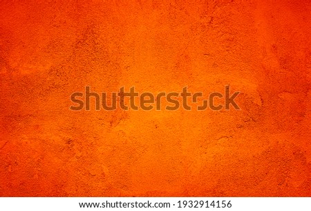 Orange Abstract Background. Painted Orange Color Stucco Wall Texture With Copy Space. Bright Art Wallpaper Royalty-Free Stock Photo #1932914156
