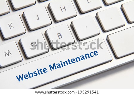 Website maintenance icon on white keyboard button