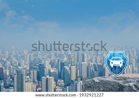 Car with shield flat icon on rock mountain over modern city tower, office building and skyscraper, Business automobile insurance concept