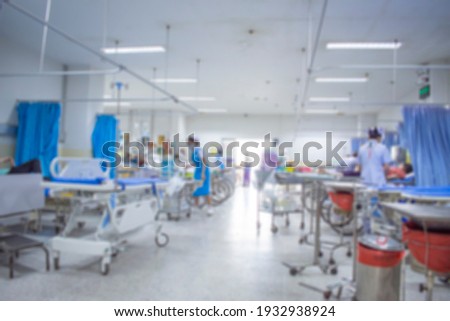 Blurred nurse in emergency room Royalty-Free Stock Photo #1932938924