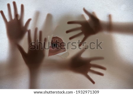 an eye and hands shadows 
