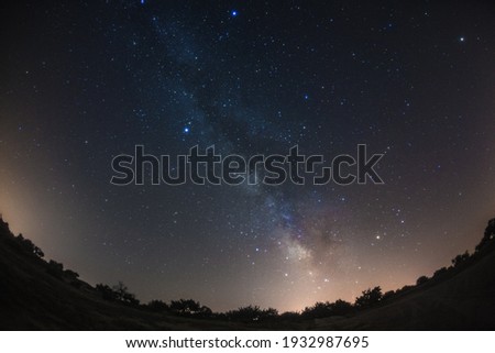 This is the starlit sky in Cappadocia, Turkey.

How about using this image for background of a calendar, a poster or any other promotional materials.