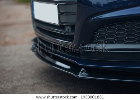 Modern sport car front lower spoiler Royalty-Free Stock Photo #1933001831