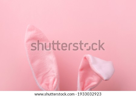pink rabbit ears over pink background, minimal easter background